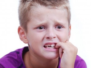 Stress expression on little blond kids face